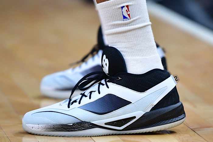 View of Kawhi Leonard's black and white New Balance shoes.